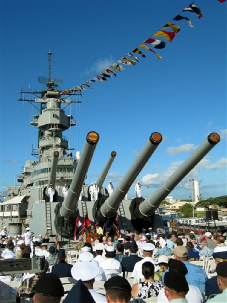 A crowd listens during a ceremony aboard the Battleship Missouri Memorial in Pearl Harbor, Hawaii, on Friday, Sept. 2, 2011, marking the 66th anniversary of the end of the war. The battleship has been moored in Pearl Harbor for the past decade. It overlooks the spot where the USS Arizona sank during the 1941 Japanese attack on Pearl Harbor.  (AP Photo/Audrey McAvoy)